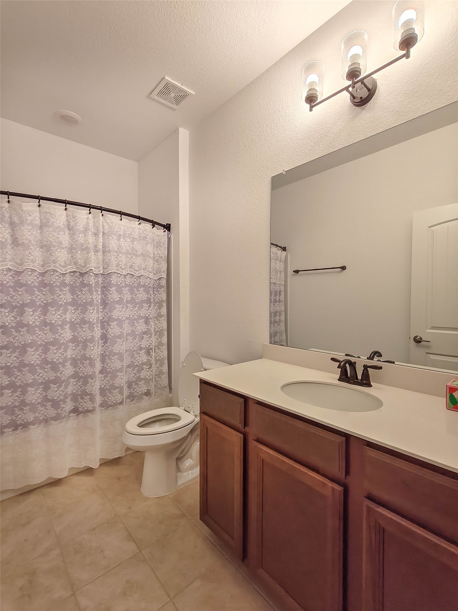 200 Fiddleneck Road Marble Falls, TX 78654 - Photo 27 of 37 a bathroom with a double vanity sink toilet and shower