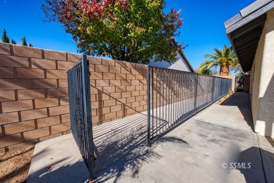 1221 Andrea Court Ridgecrest, CA 93555 - Photo 48 of 50 a view of a backyard with a tree