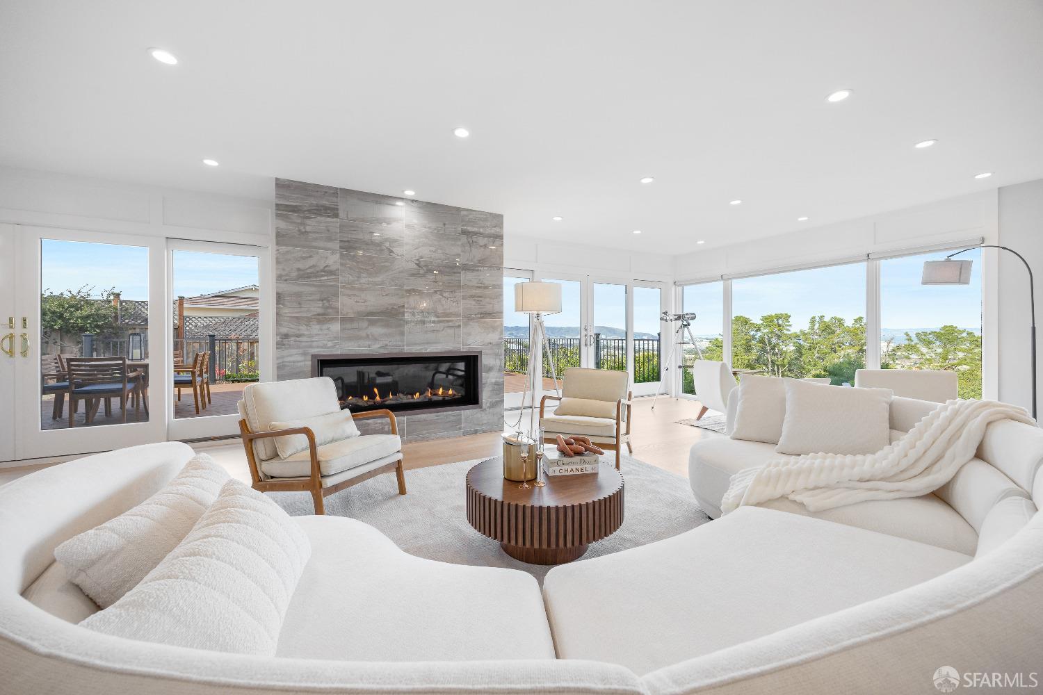 1270 Roble Road Millbrae, CA 94030 - Photo 11 of 61 a living room with furniture fireplace and a large window