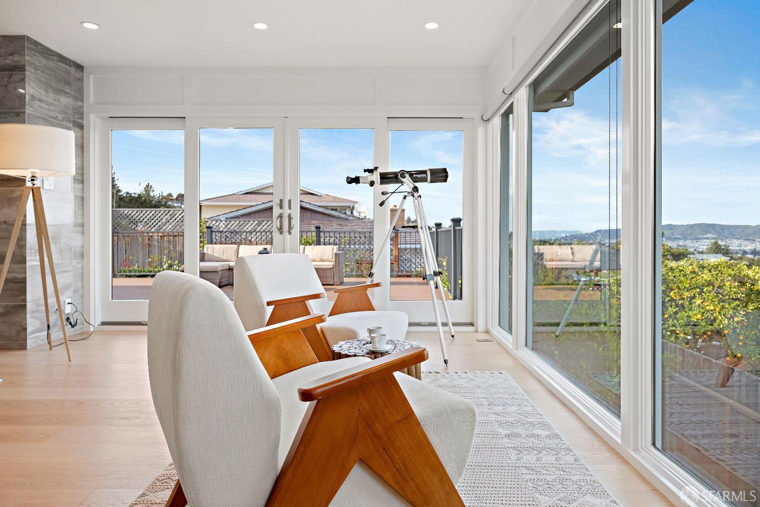 1270 Roble Road Millbrae, CA 94030 - Photo 13 of 61 a living room with furniture and a floor to ceiling window