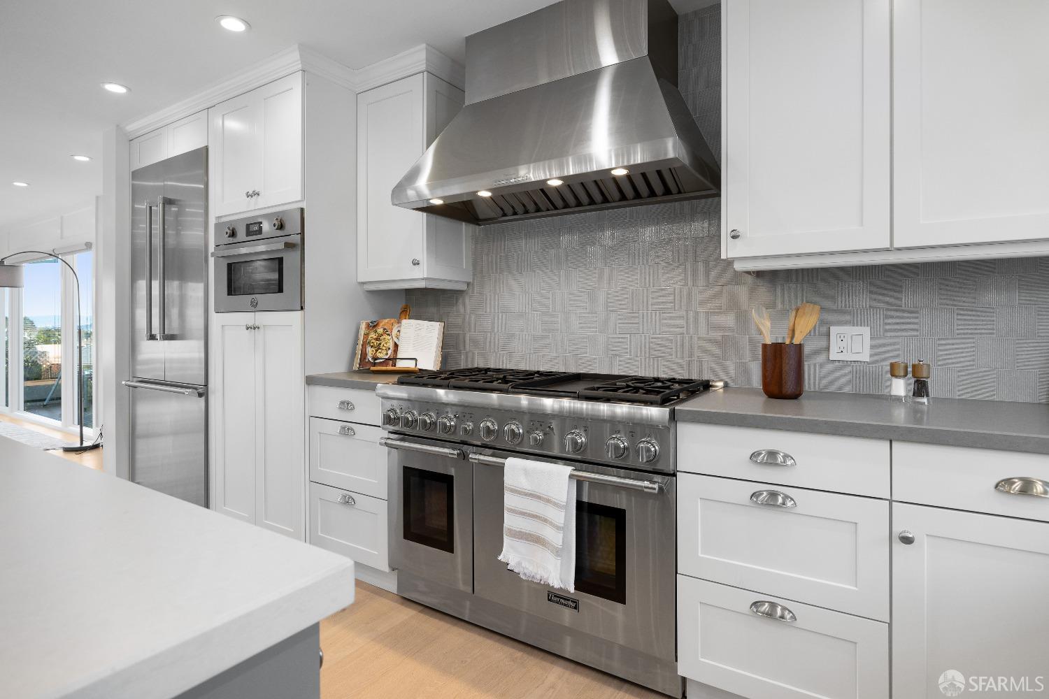 1270 Roble Road Millbrae, CA 94030 - Photo 18 of 61 a kitchen with stainless steel appliances granite countertop a stove a refrigerator and a sink