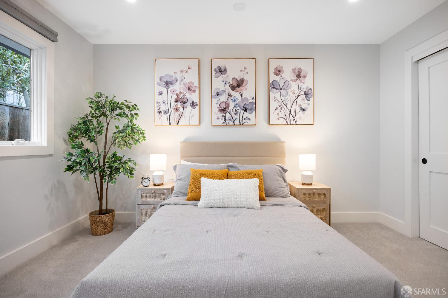 1270 Roble Road Millbrae, CA 94030 - Photo 39 of 61 a bedroom with a large bed and a potted plant