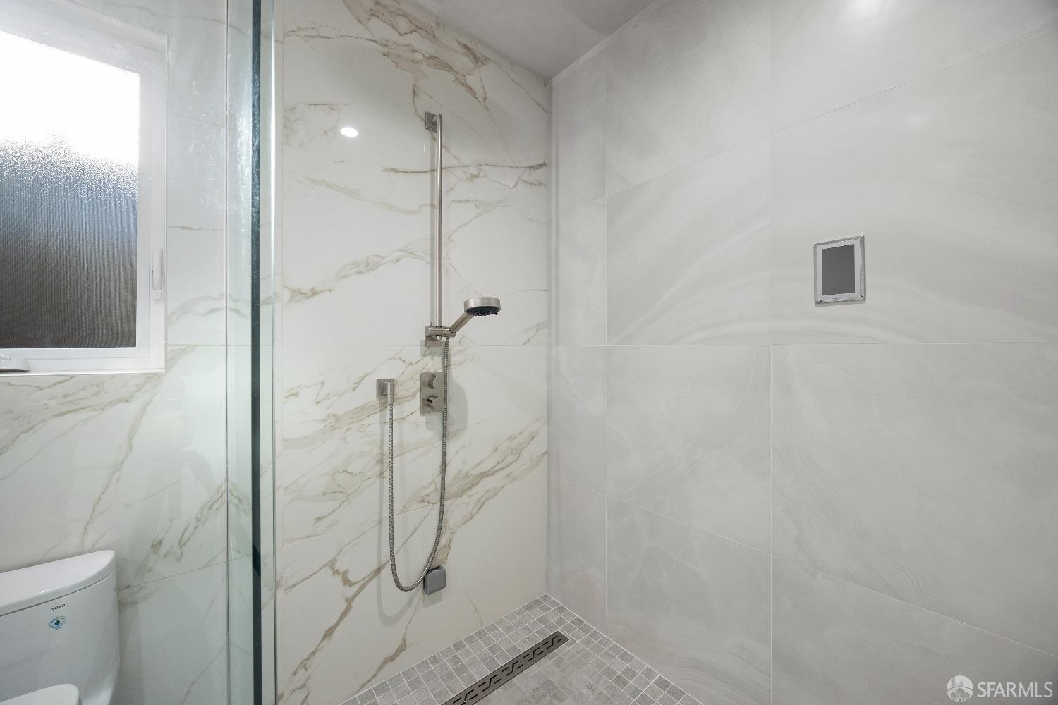 1270 Roble Road Millbrae, CA 94030 - Photo 47 of 61 a bathroom with a shower and toilet