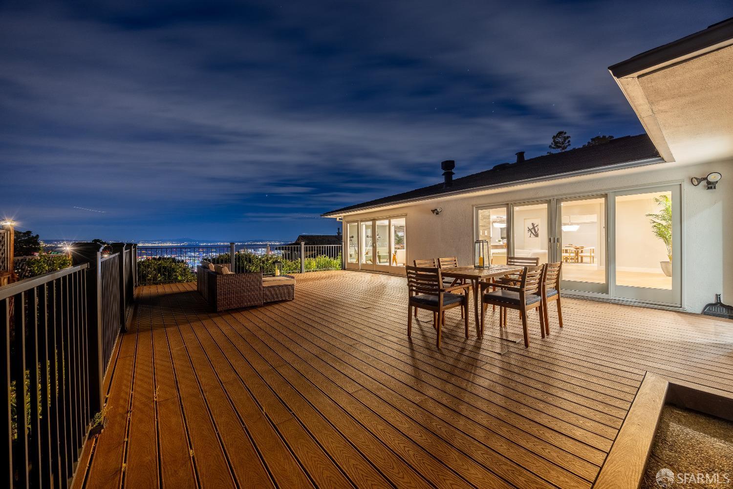 1270 Roble Road Millbrae, CA 94030 - Photo 60 of 61 a view of a patio with table and chairs with wooden floor and fence