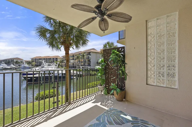 a balcony with a tree in the background