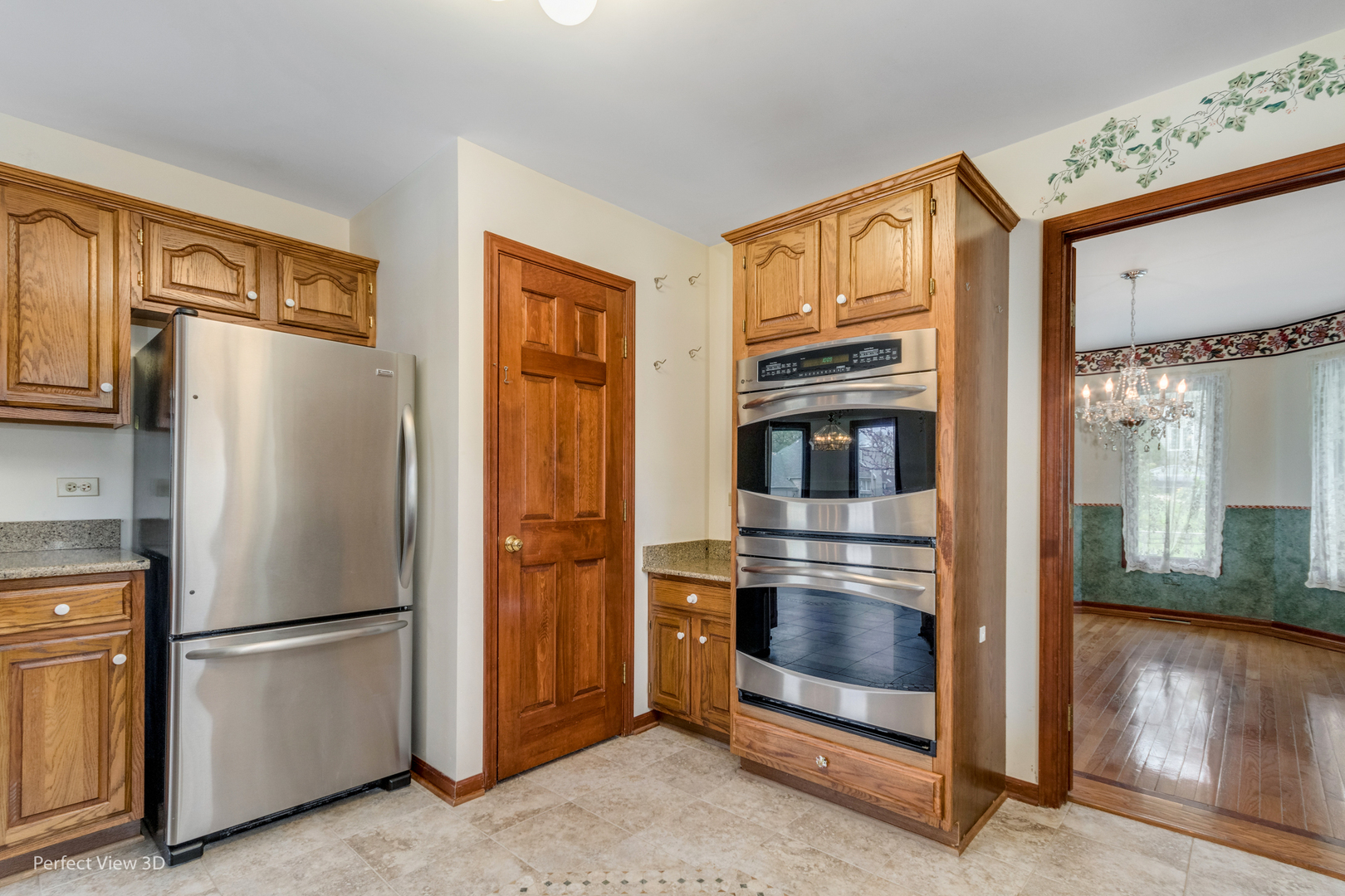 1 Genesee Court Bolingbrook, IL 60440 - Photo 11 of 29 a metallic refrigerator freezer sitting in a kitchen