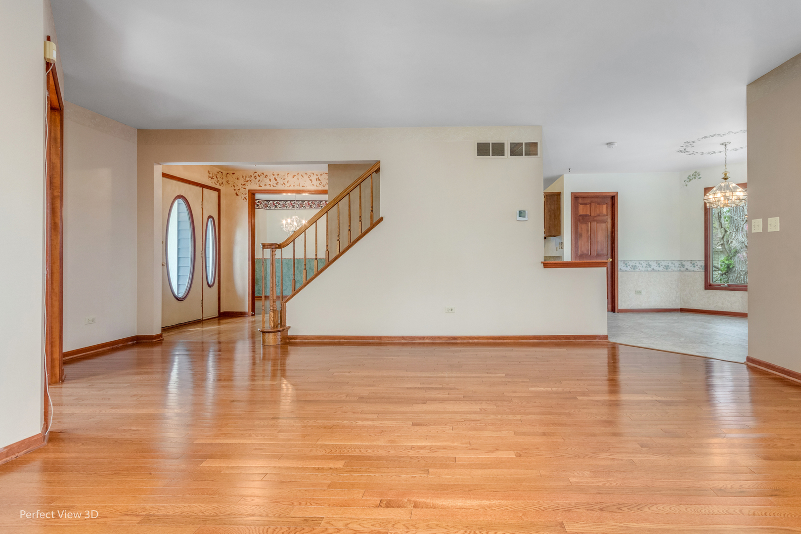 1 Genesee Court Bolingbrook, IL 60440 - Photo 5 of 29 a view of an empty room with wooden floor and a window
