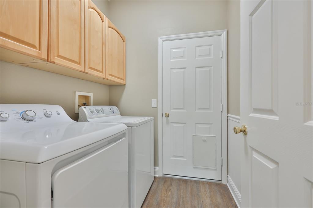 708 Coade Stone Drive Seffner, FL 33584 - Photo 32 of 48 a utility room with dryer and washer