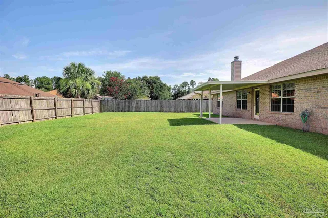 a view of a backyard with a garden and plants