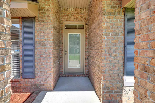 a view of a brick house with a large door
