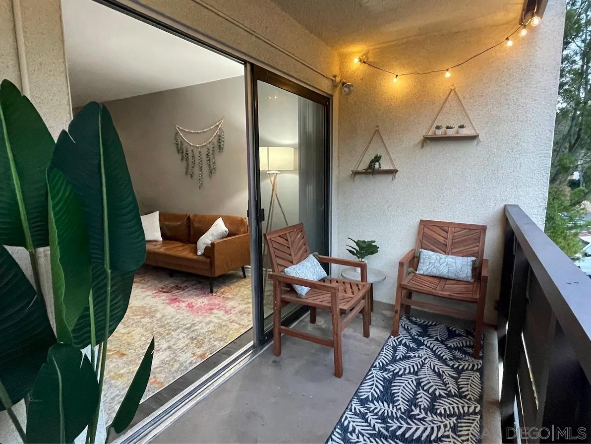 1621 Unit E 217, Unit E217 San Diego, CA 92108 - Photo 13 of 45 a living room with furniture and a rug
