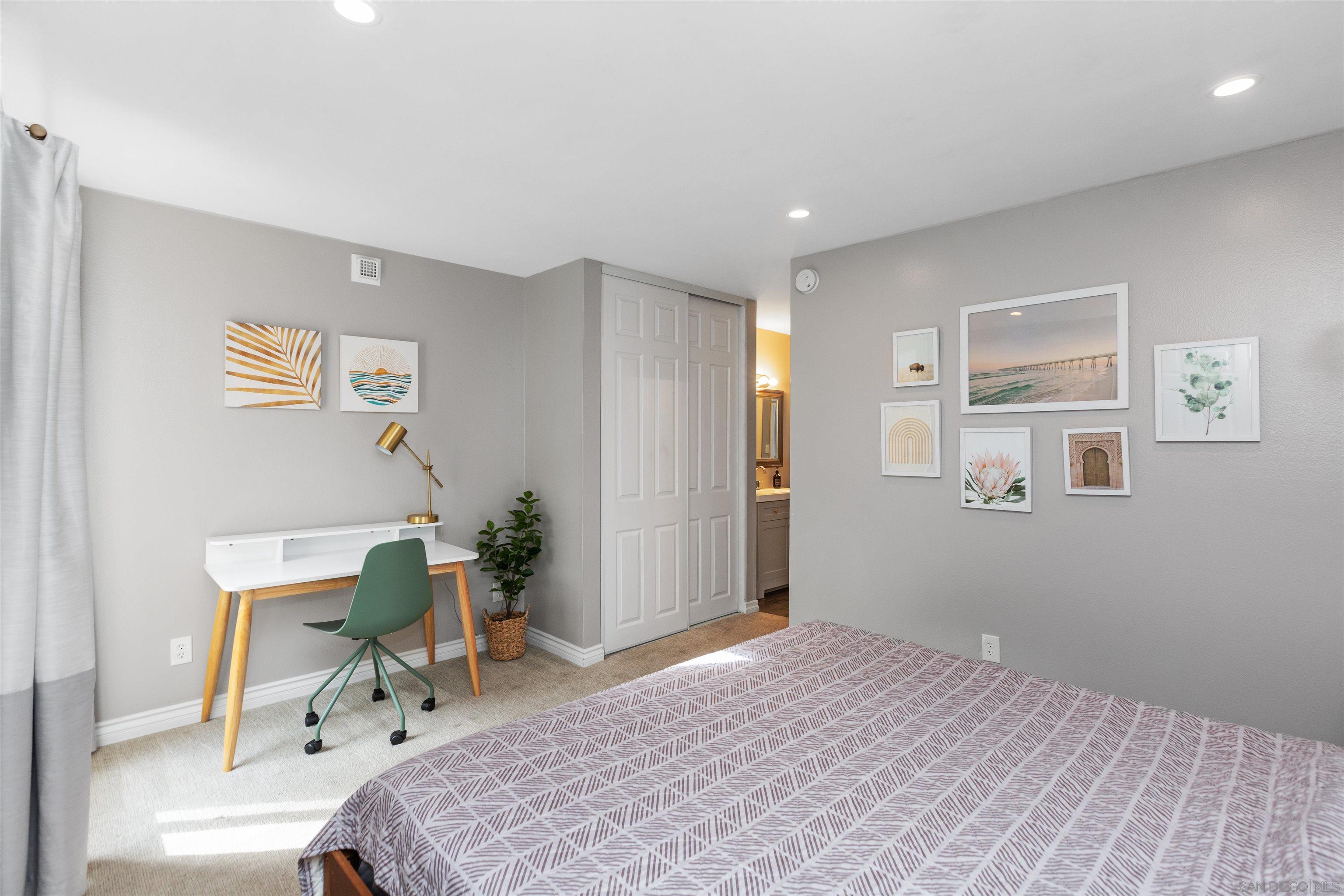 1621 Unit E 217, Unit E217 San Diego, CA 92108 - Photo 18 of 45 a bedroom with a bed and furniture