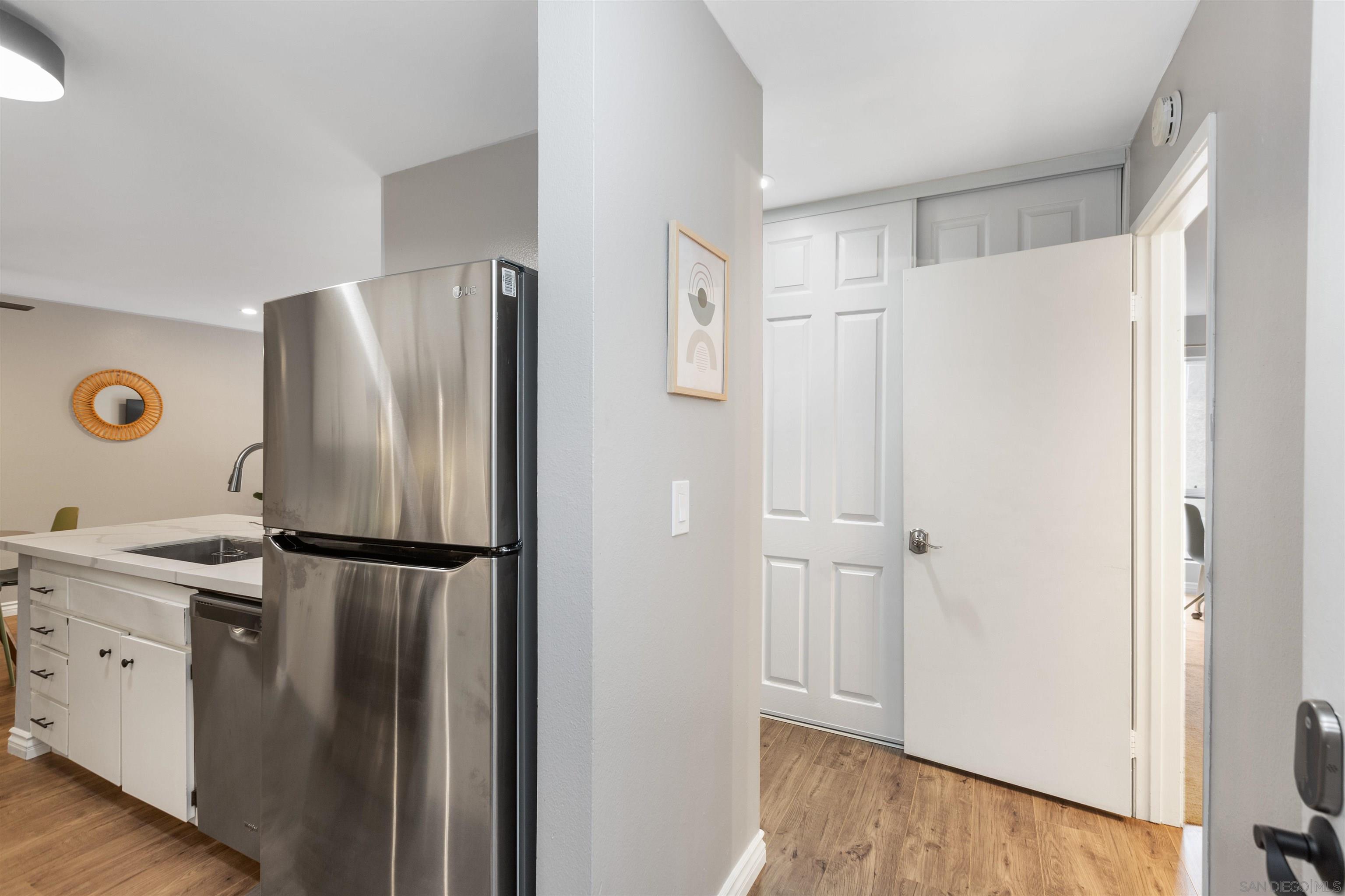 1621 Unit E 217, Unit E217 San Diego, CA 92108 - Photo 2 of 45 a kitchen with stainless steel appliances a refrigerator and a sink