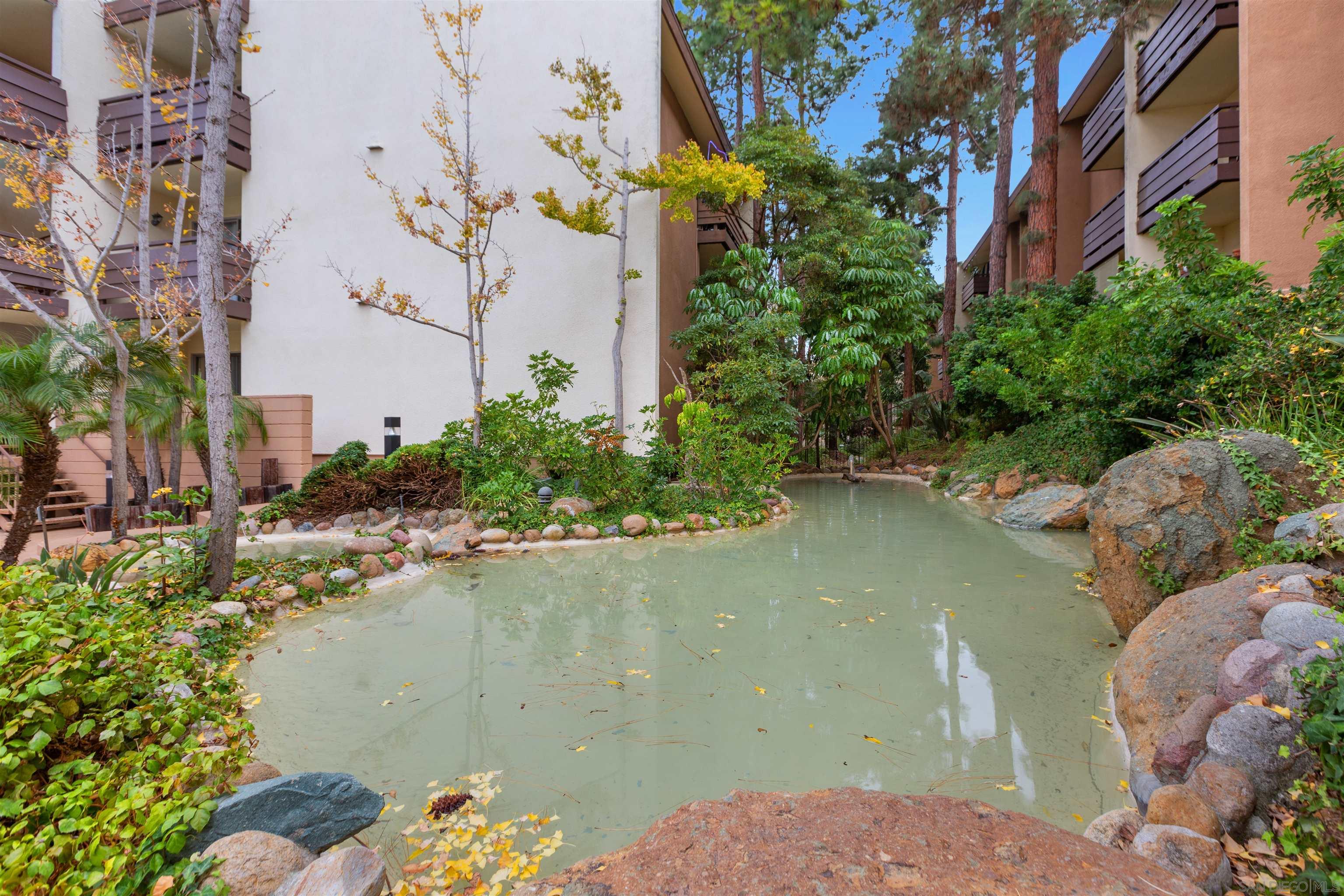 1621 Unit E 217, Unit E217 San Diego, CA 92108 - Photo 22 of 45 a view of a lake in middle of the house