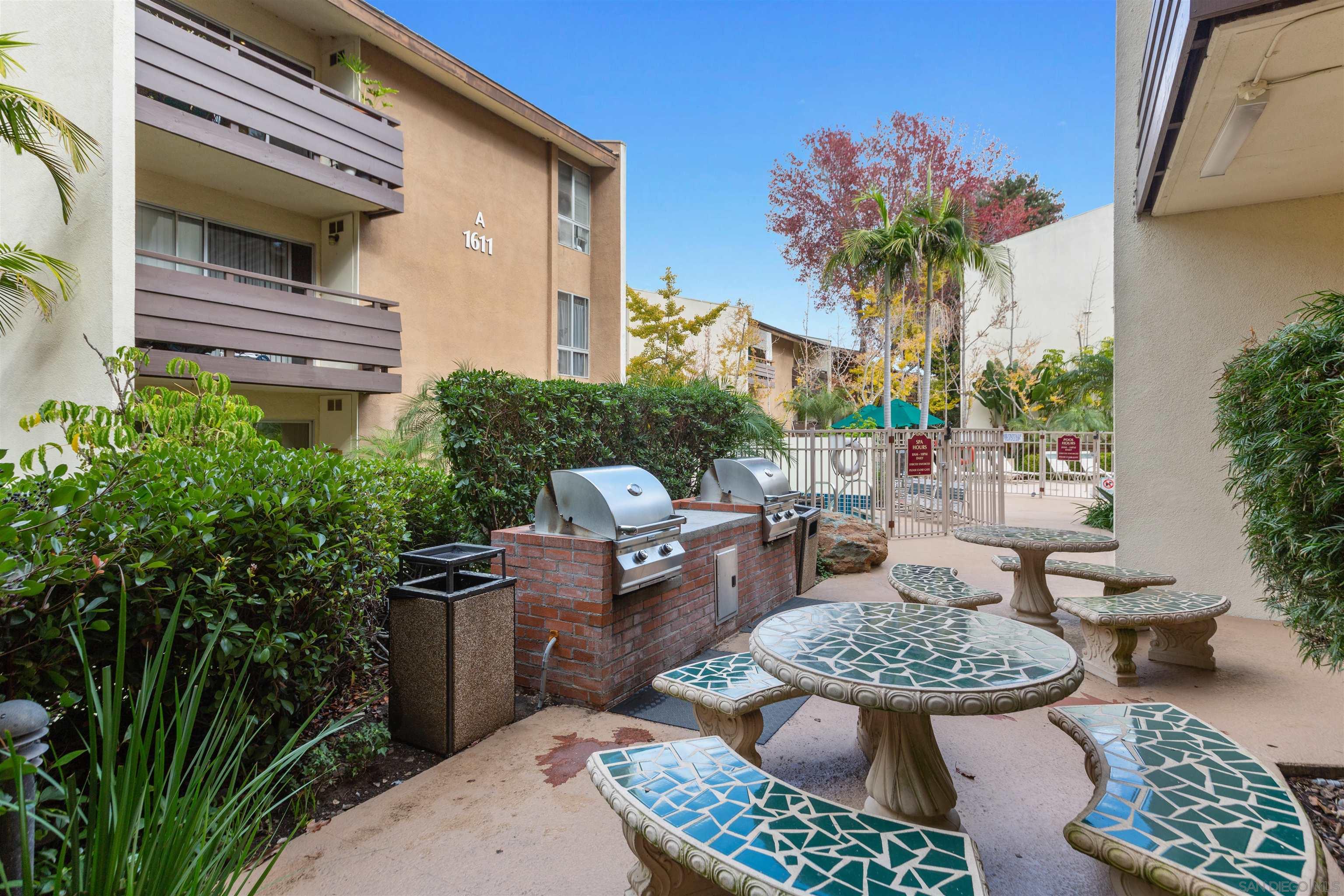 1621 Unit E 217, Unit E217 San Diego, CA 92108 - Photo 34 of 45 a view of a patio with couches and potted plants