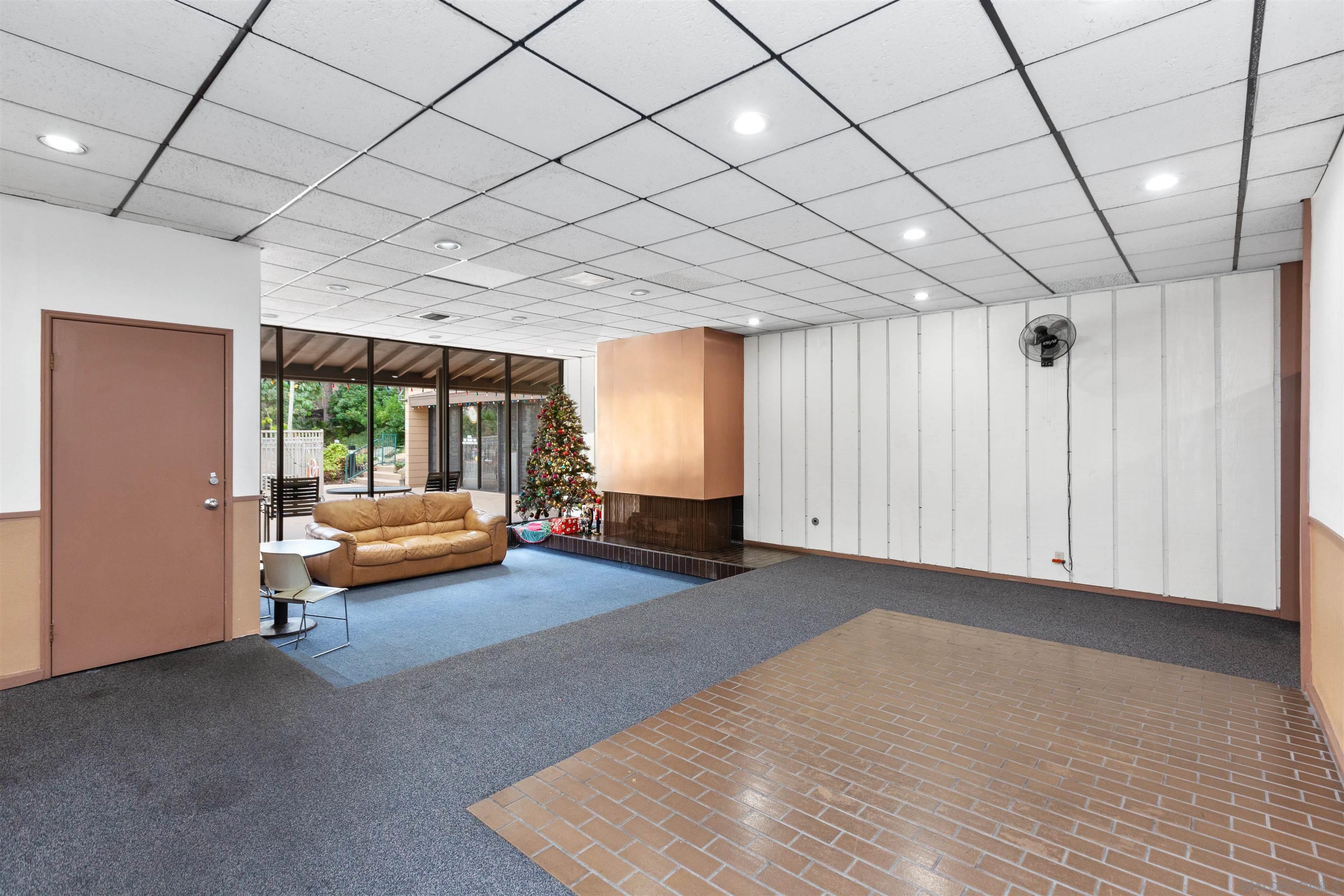 1621 Unit E 217, Unit E217 San Diego, CA 92108 - Photo 39 of 45 a blue room with furniture and a window