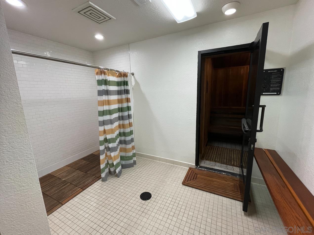 1621 Unit E 217, Unit E217 San Diego, CA 92108 - Photo 42 of 45 a bathroom with a sink and a shower