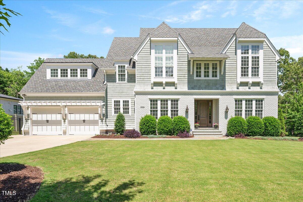 6502 New Market Way Raleigh, NC 27615 - Photo 1 of 54 front view of a house with a yard