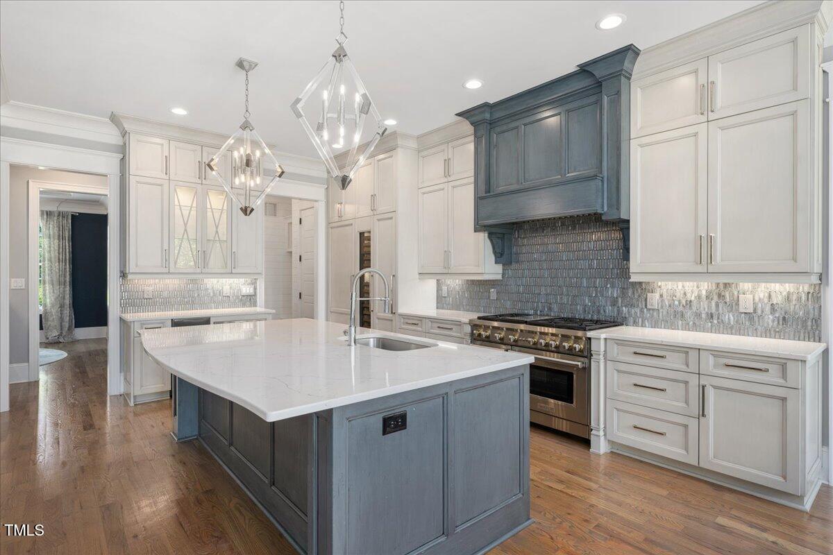 6502 New Market Way Raleigh, NC 27615 - Photo 12 of 54 a large kitchen with stainless steel appliances granite countertop a lot of counter space and cabinets