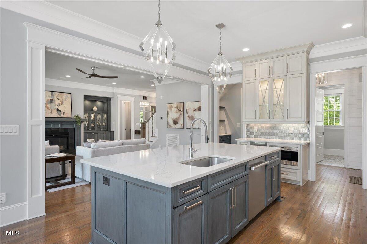 6502 New Market Way Raleigh, NC 27615 - Photo 15 of 54 a large kitchen with kitchen island a sink stainless steel appliances and cabinets