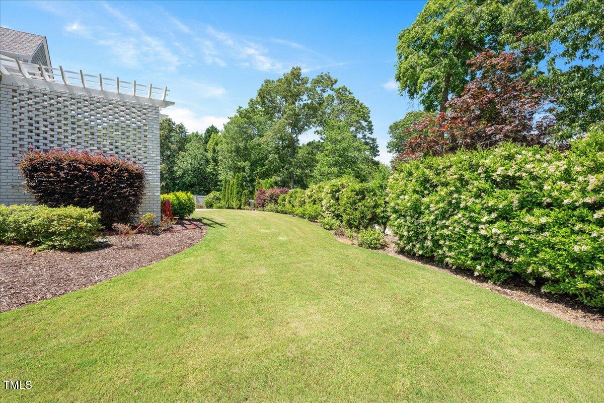 6502 New Market Way Raleigh, NC 27615 - Photo 40 of 54 a view of a backyard of the house