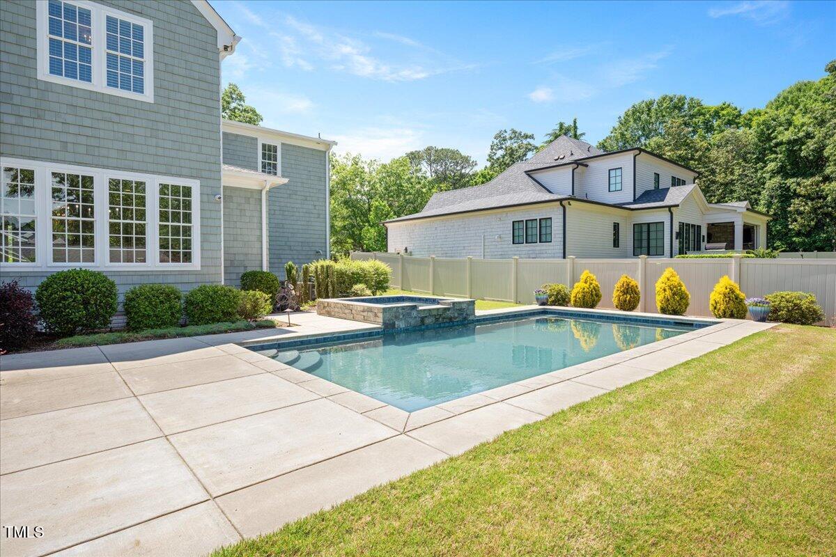 6502 New Market Way Raleigh, NC 27615 - Photo 42 of 54 a front view of house and yard with swimming pool and porch