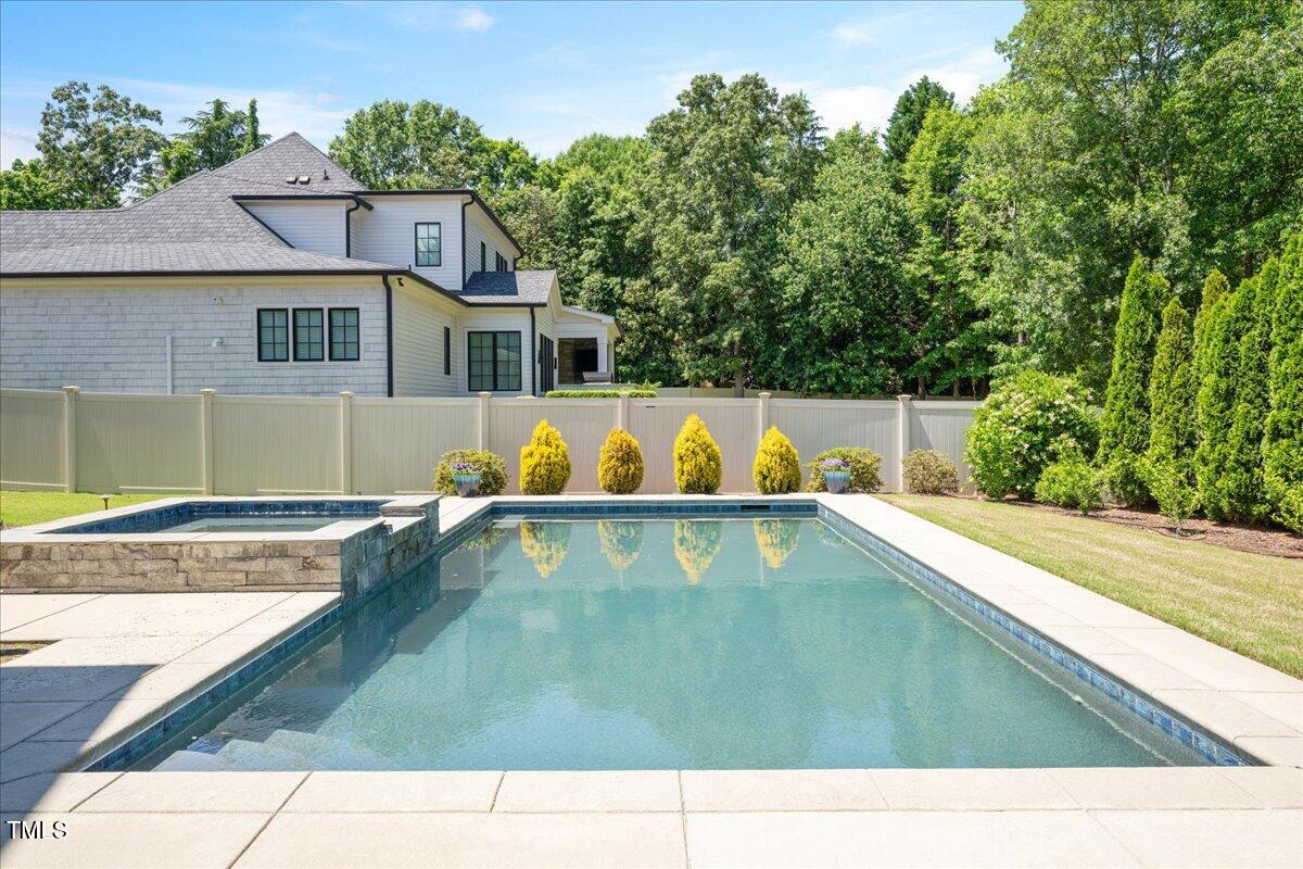 6502 New Market Way Raleigh, NC 27615 - Photo 45 of 54 a view of a swimming pool with a patio