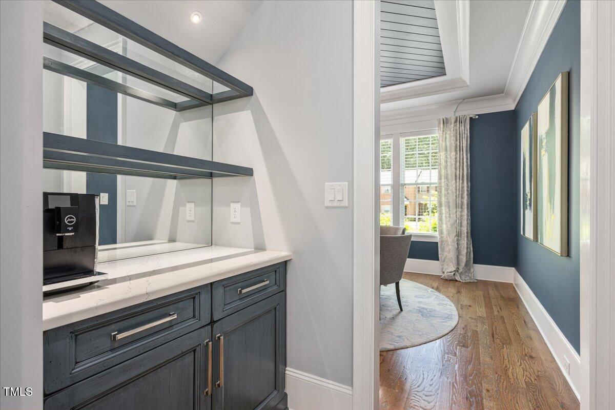 6502 New Market Way Raleigh, NC 27615 - Photo 7 of 54 a view of a hallway and a livingroom with furniture