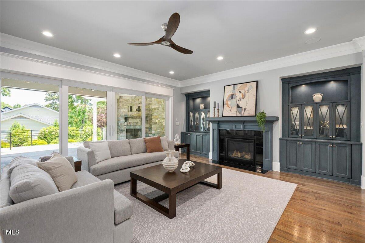 6502 New Market Way Raleigh, NC 27615 - Photo 8 of 54 a living room with furniture and a fireplace