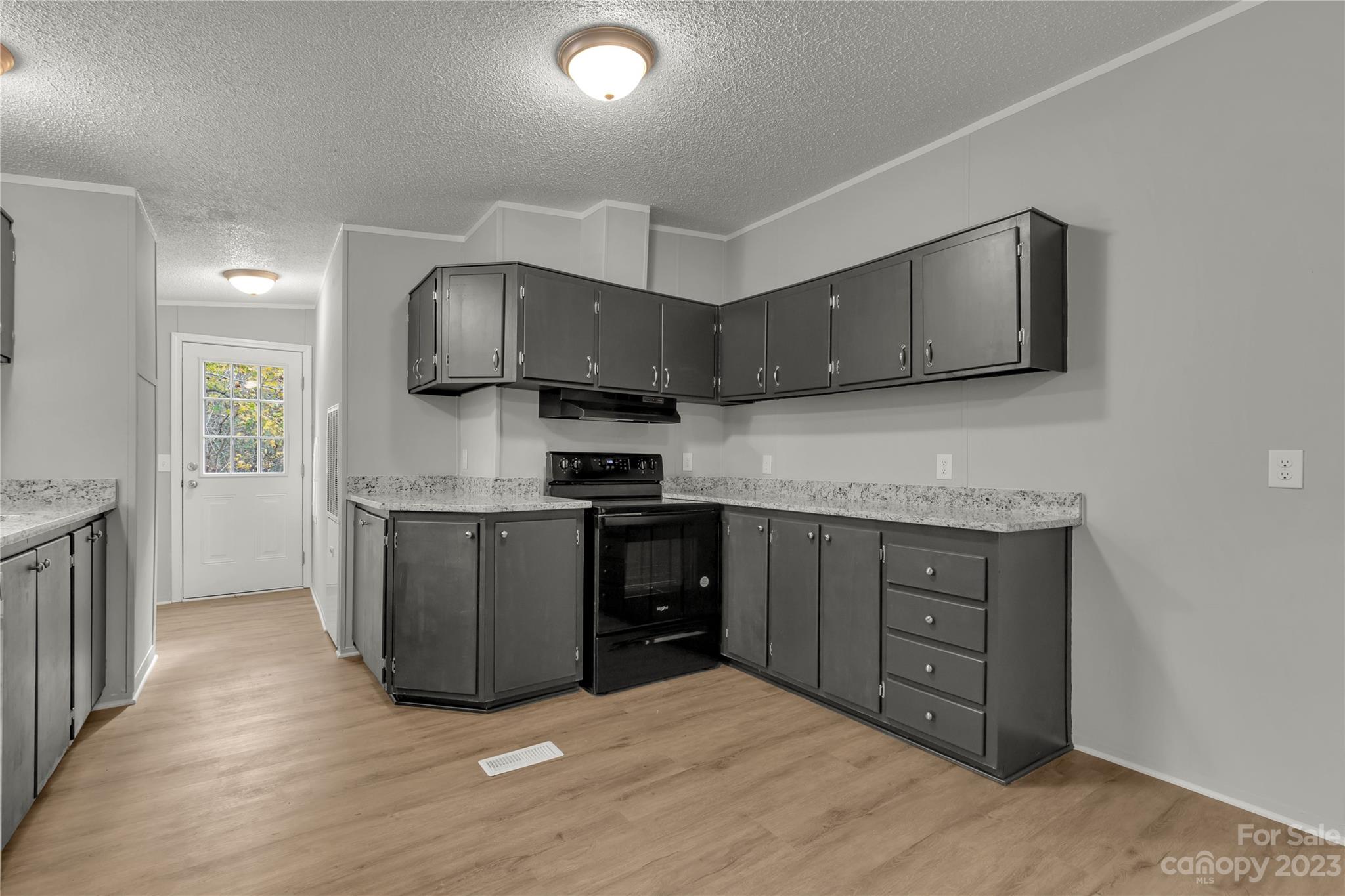 995 Longleaf Road York, SC 29745 - Photo 12 of 30 a kitchen with stainless steel appliances granite countertop a stove a sink and a microwave