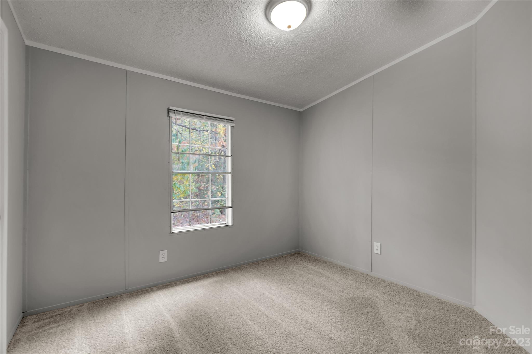 995 Longleaf Road York, SC 29745 - Photo 22 of 30 an empty room with a window and mirror