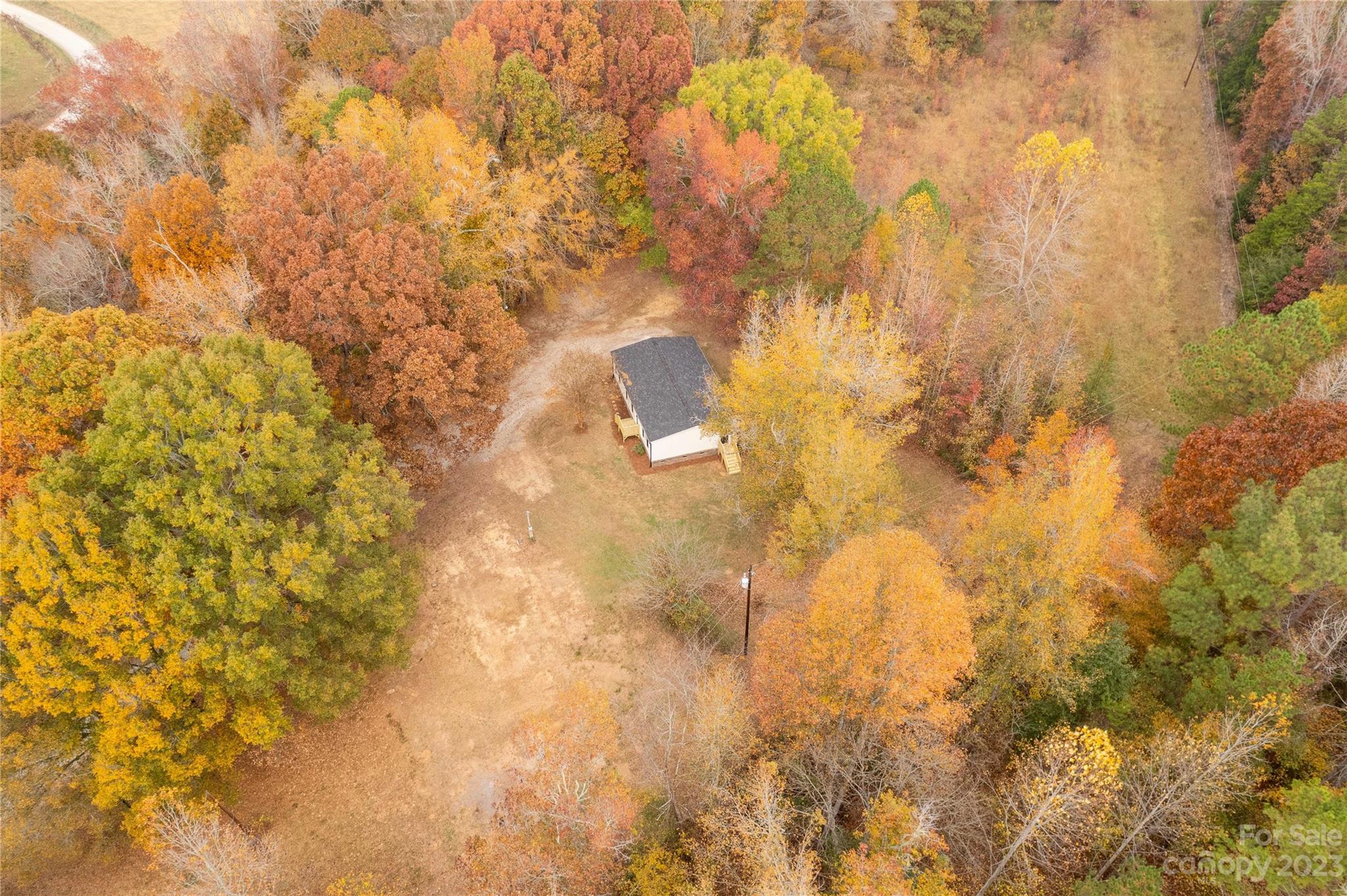 995 Longleaf Road York, SC 29745 - Photo 25 of 30 a backyard of a house with large trees