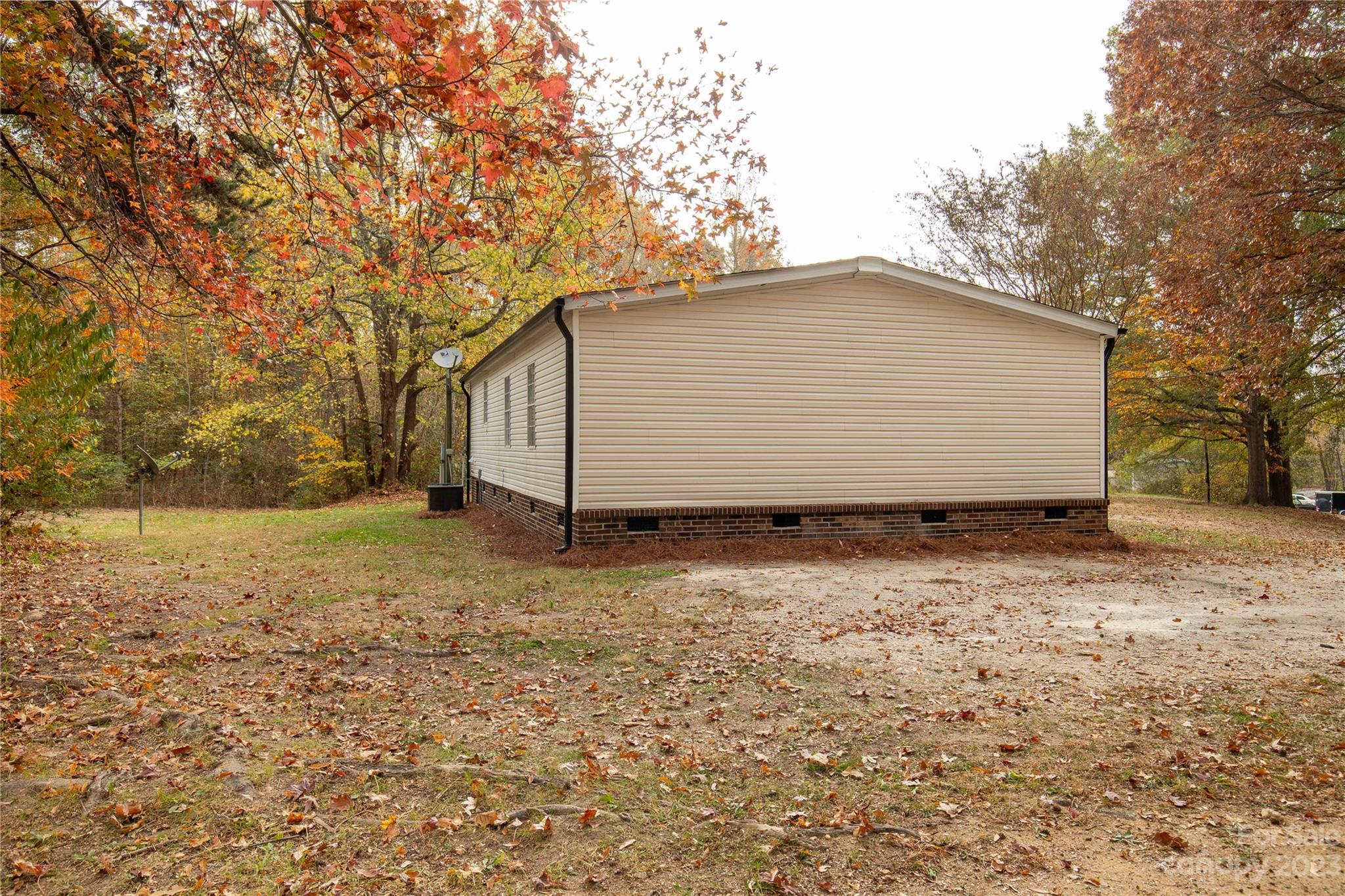 995 Longleaf Road York, SC 29745 - Photo 6 of 30 a house with trees in the background