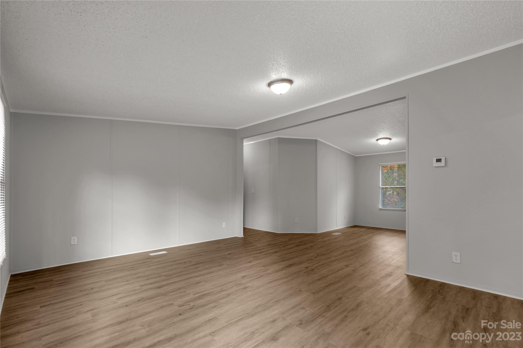 995 Longleaf Road York, SC 29745 - Photo 7 of 30 a view of an empty room with wooden floor