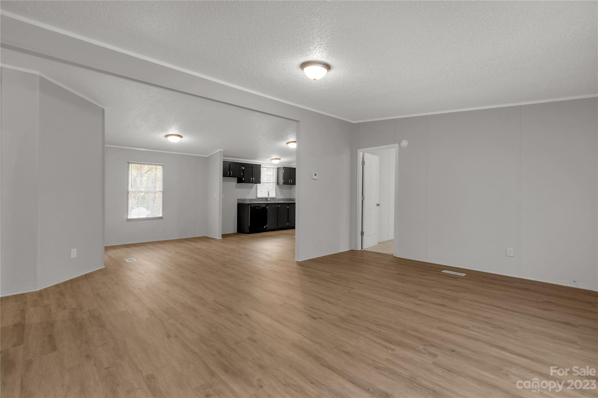 995 Longleaf Road York, SC 29745 - Photo 8 of 30 a view of an empty room with window and wooden floor
