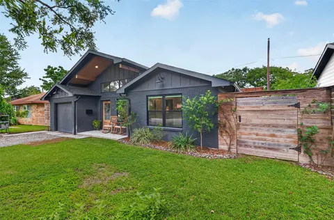 a backyard of a house with seating space