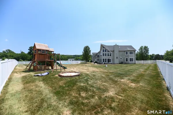 a view of a swimming pool with a yard