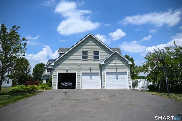 a view of house with outdoor space and trees