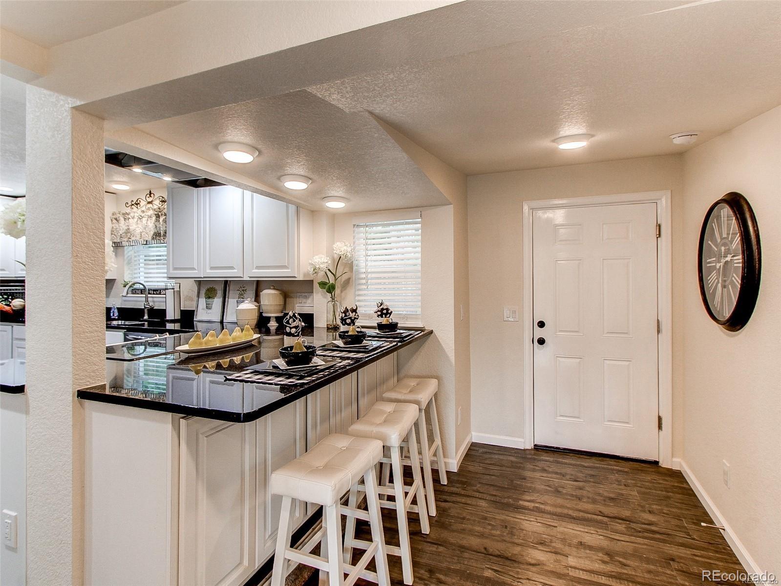 665 Juniper Street Golden, CO 80401 - Photo 13 of 44 a kitchen with a table and chairs