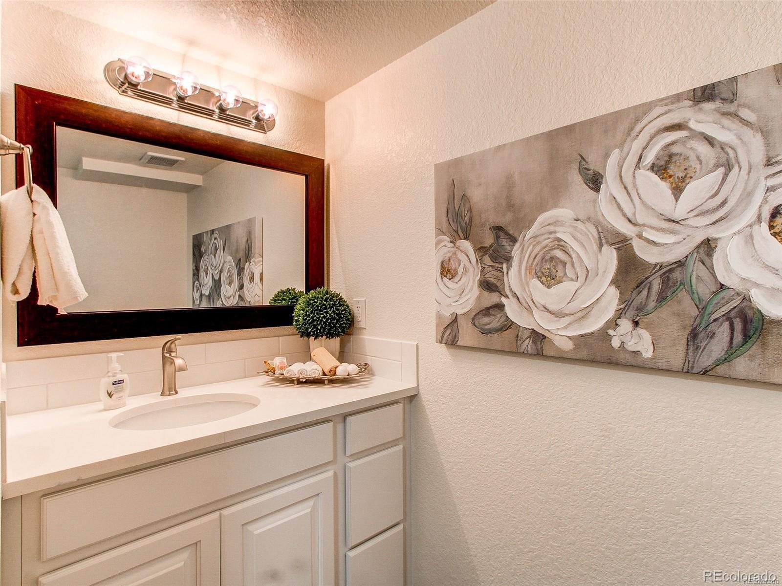 665 Juniper Street Golden, CO 80401 - Photo 16 of 44 a bathroom with a sink and a mirror