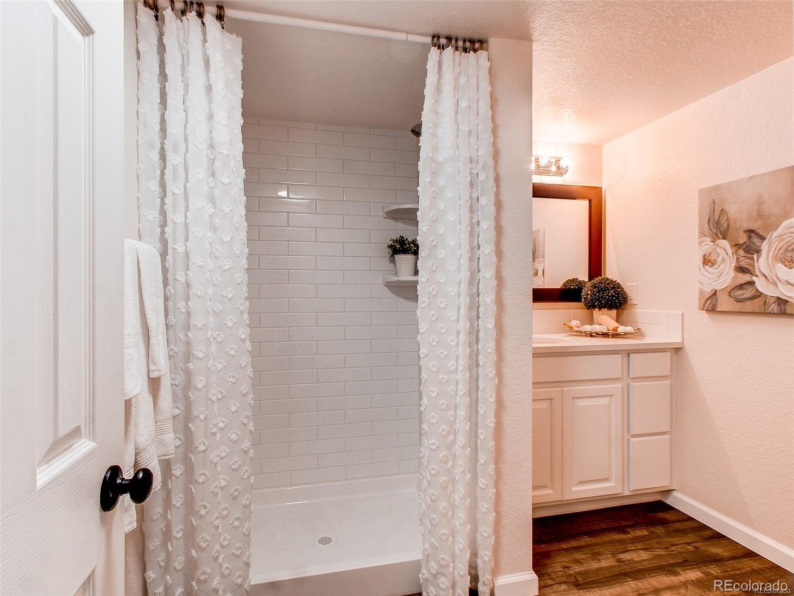 665 Juniper Street Golden, CO 80401 - Photo 17 of 44 a bathroom with a sink and a mirror