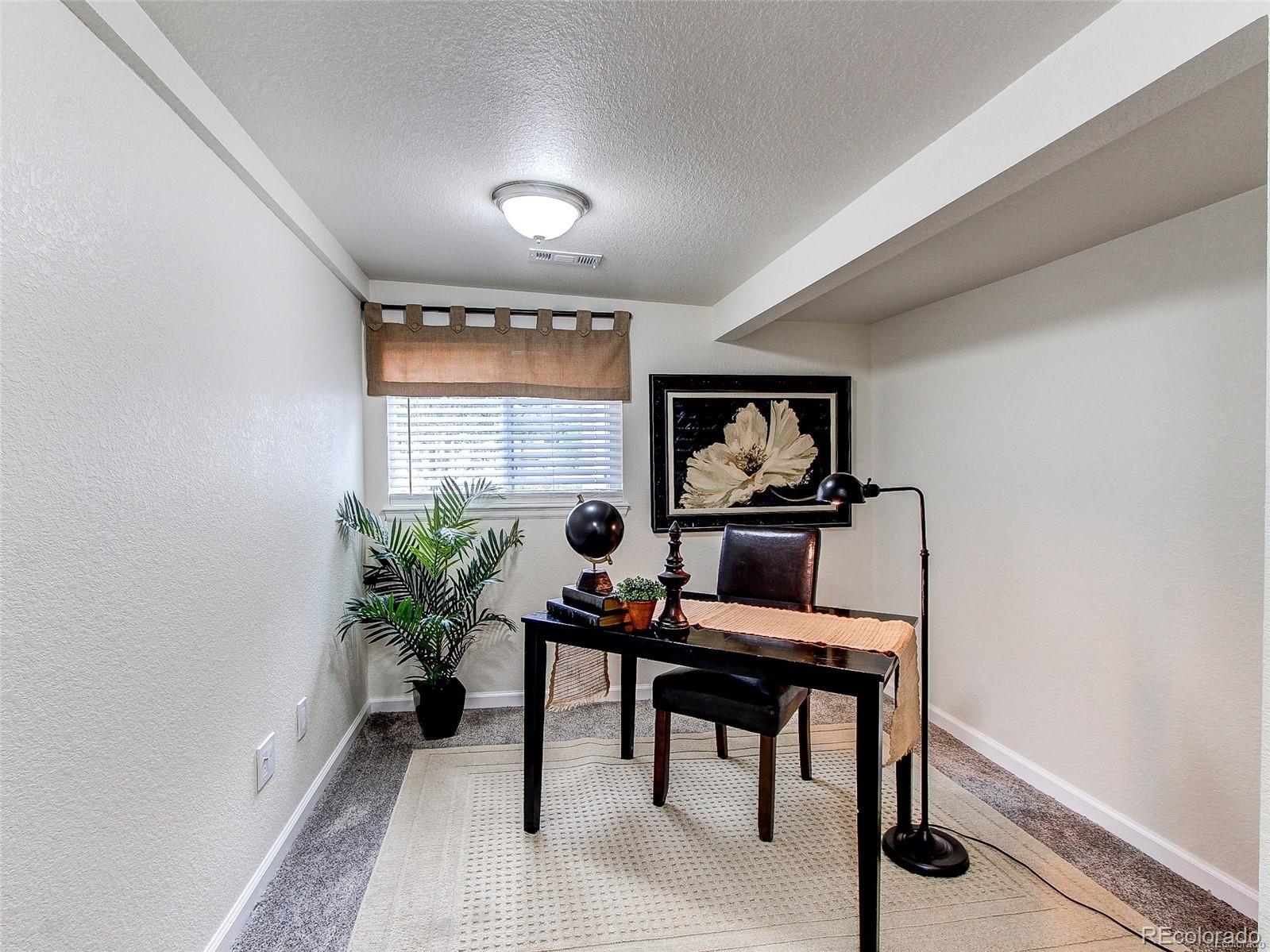 665 Juniper Street Golden, CO 80401 - Photo 23 of 44 a workspace with furniture and a potted plant