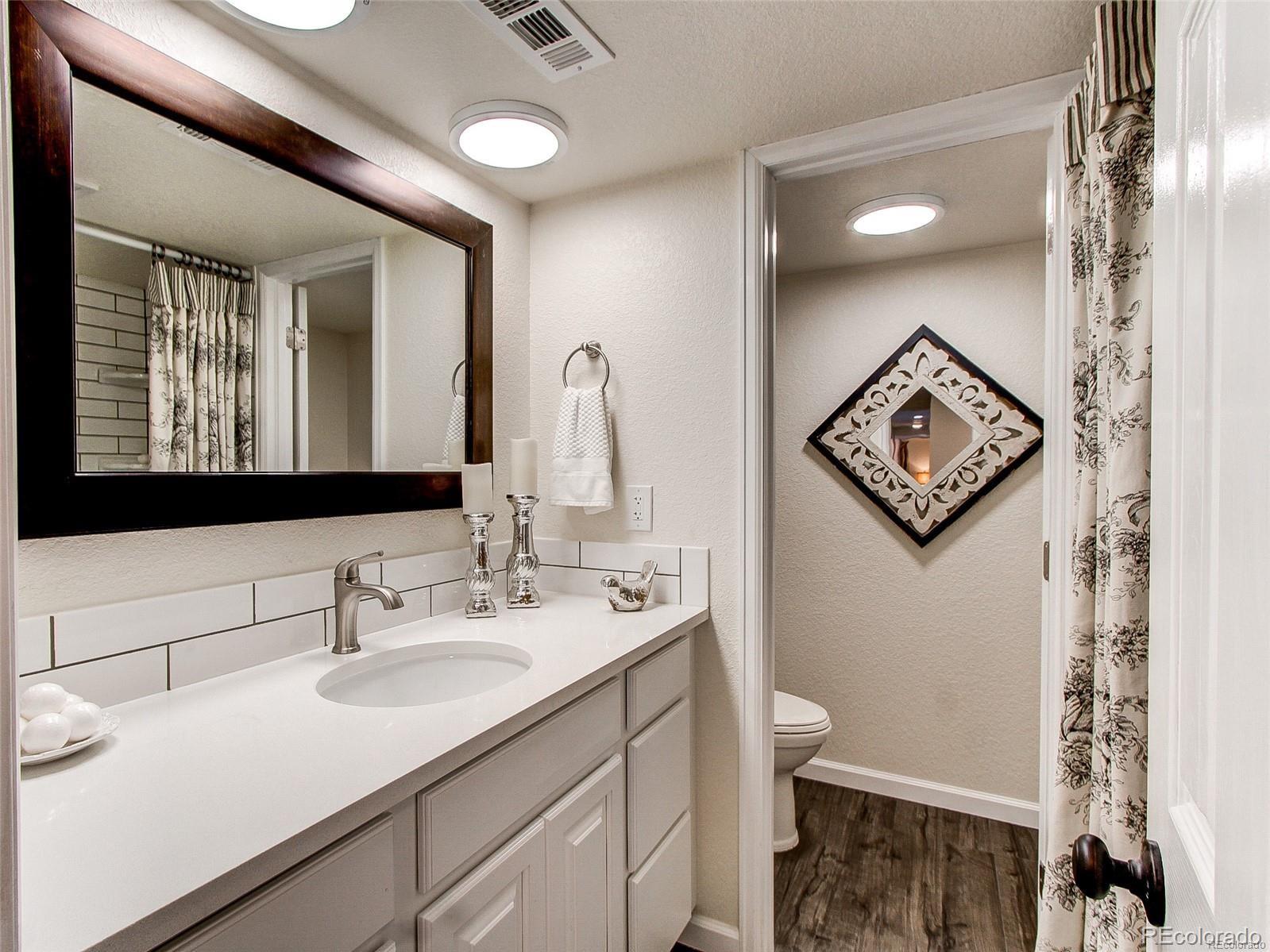 665 Juniper Street Golden, CO 80401 - Photo 25 of 44 a bathroom with a sink and a mirror