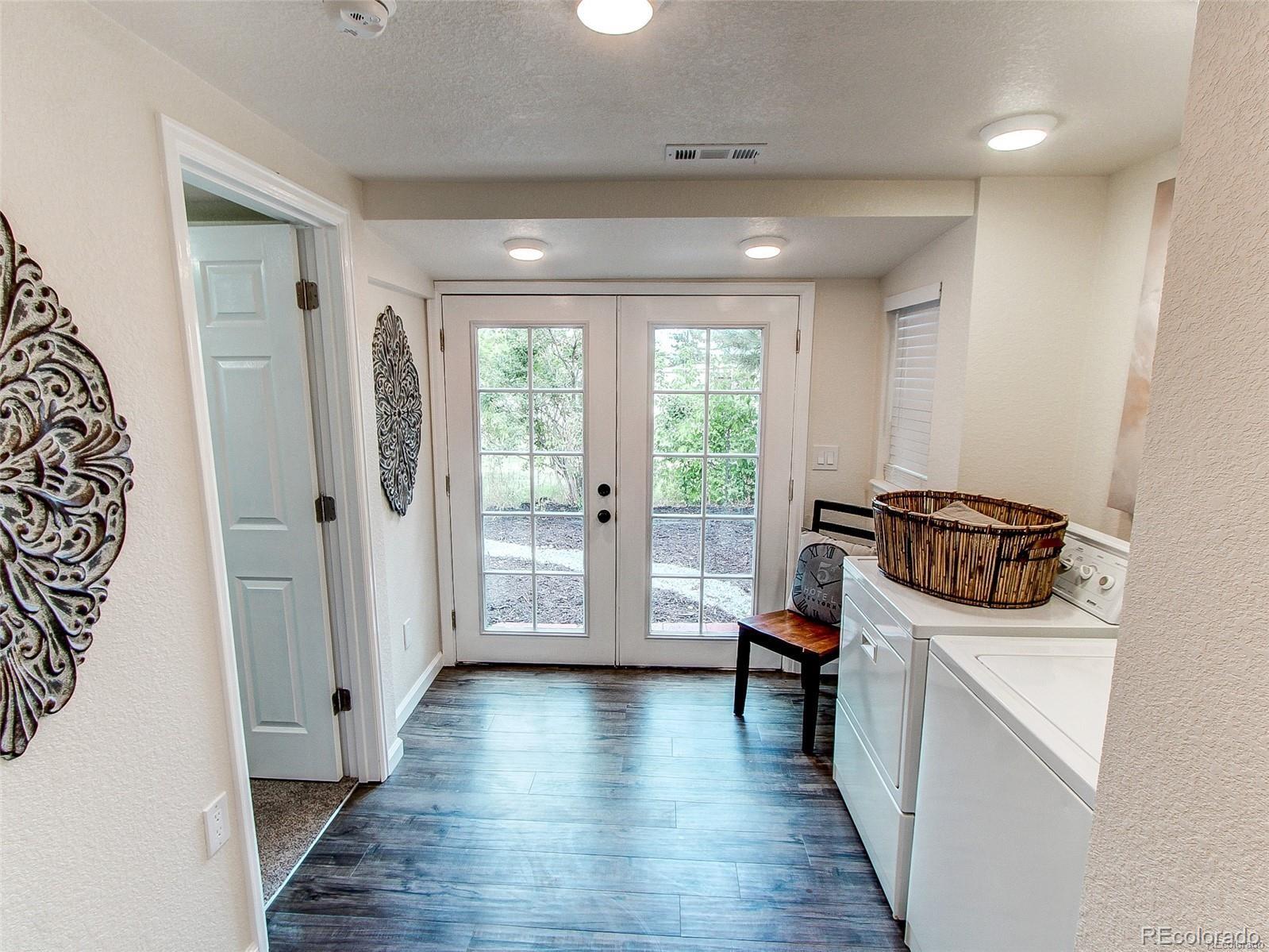 665 Juniper Street Golden, CO 80401 - Photo 27 of 44 a view of a hallway with furniture and wooden floor
