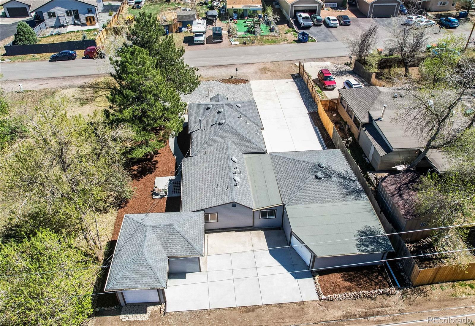 665 Juniper Street Golden, CO 80401 - Photo 3 of 44 an aerial view of a house with swimming pool and large trees