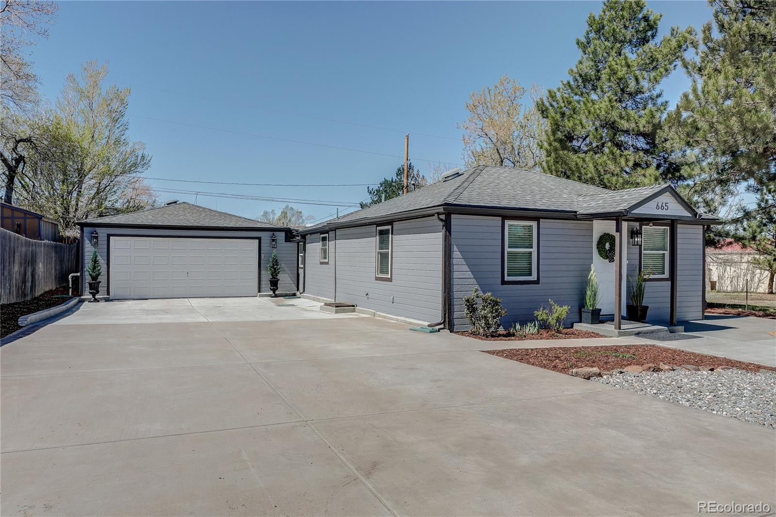 665 Juniper Street Golden, CO 80401 - Photo 40 of 44 a front view of a house with a garden and yard