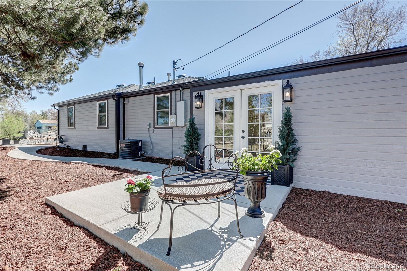 665 Juniper Street Golden, CO 80401 - Photo 4 of 44 a view of a house with backyard sitting area and garden