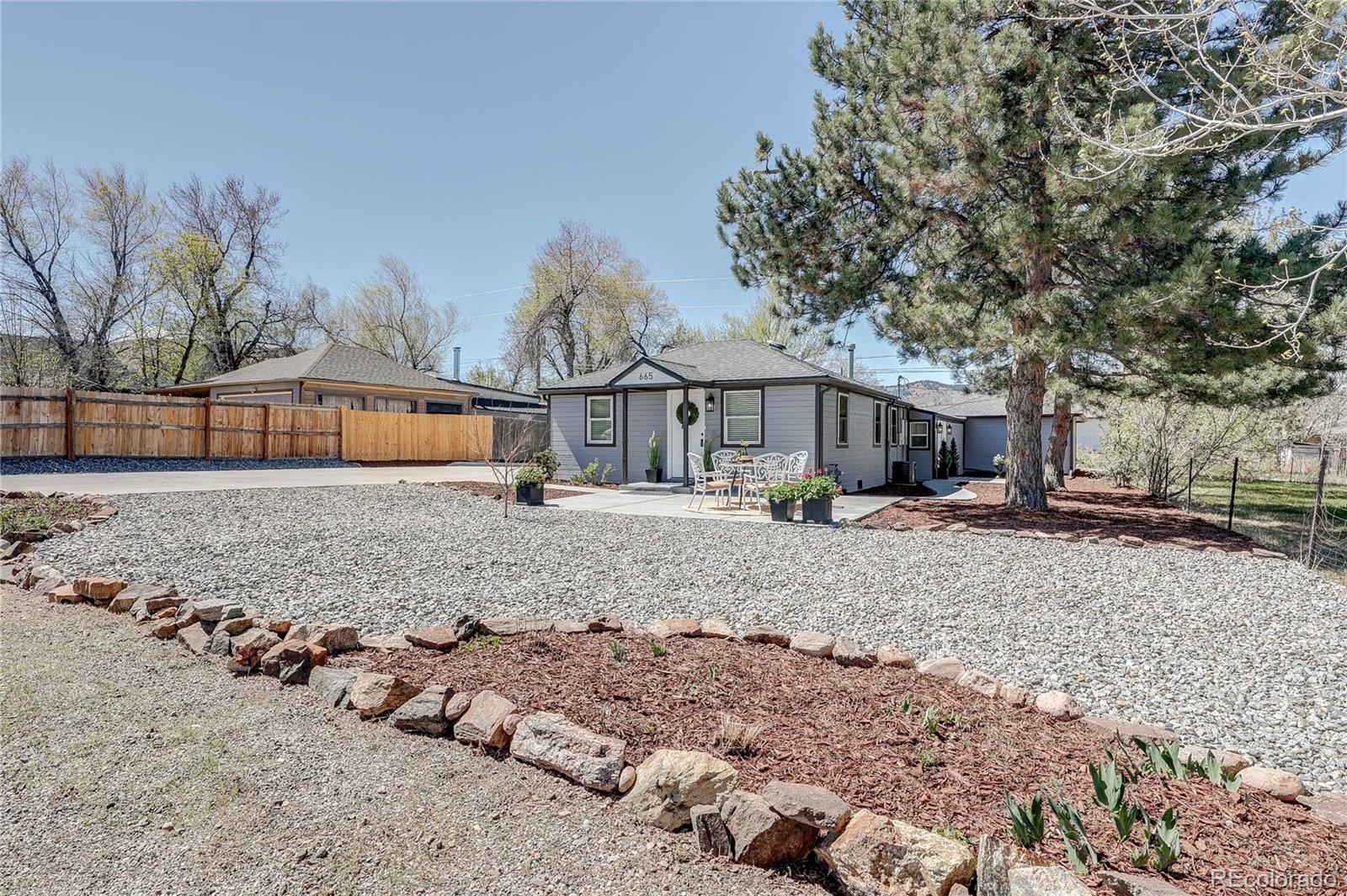 665 Juniper Street Golden, CO 80401 - Photo 43 of 44 a front view of a house with a yard