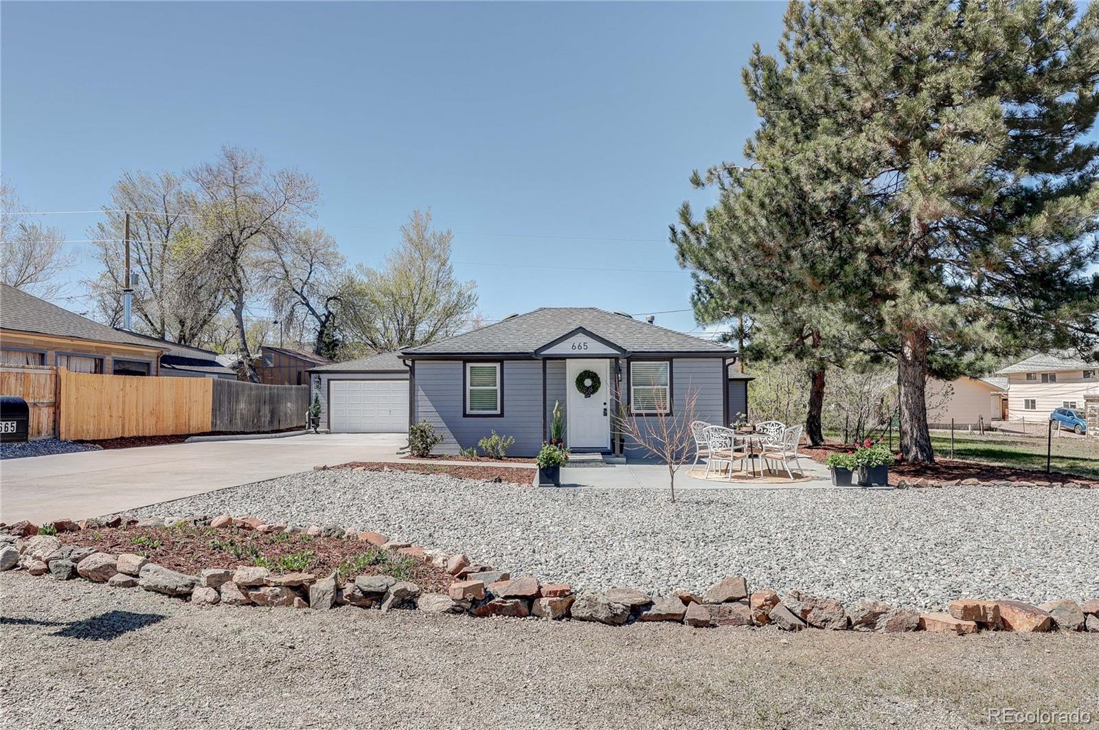665 Juniper Street Golden, CO 80401 - Photo 44 of 44 a front view of a house with a yard covered in snow