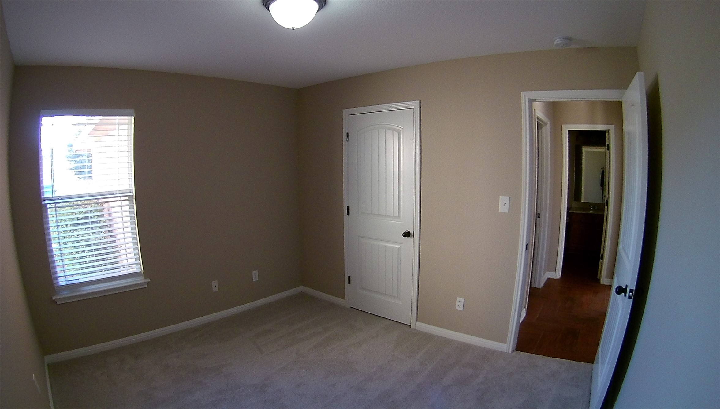 3304 Wickham Lane Austin, TX 78725 - Photo 7 of 13 Unfurnished bedroom with a closet and light carpet